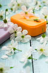 soaps with cherry flowers on old blue wood table