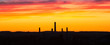 © v_l - Industrial panorama on the background of a colorful dramatic sky with clouds at sunset.