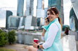 © nuclear_lily - Portrait of business woman sitting with phone and cup of coffee