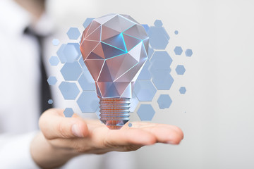  holding illuminated light bulb, idea, innovation and inspiration concept.