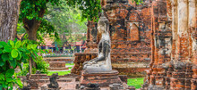 Only Intact Ancient Buddha Statue Among The Destroyed Statues In Ayutthaya Historical Park, Thailand.
