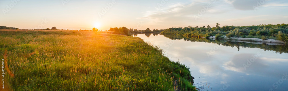 Beautiful evening natural landscape near the river during sunset. Ryazan region village Lasitsy - obrazy, fototapety, plakaty 
