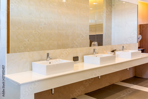 Fotomural Modern wash basin sink counter with mirror in toilet and marble wall interior co