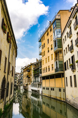 Wall Mural - Water channel San Massimo runs among residential houses in the centre of the old city Padua, Italy