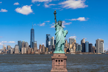Fototapete - The Statue of Liberty over the Scene of New york cityscape river side which location is lower manhattan,Architecture and building with tourist concept