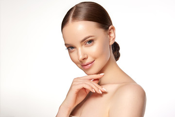 beautiful young woman with clean fresh skin . facial treatment . cosmetology , beauty and spa . nice