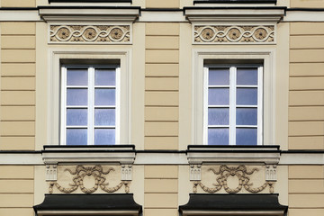 Window decoration of buildings of Krakow suburb street.