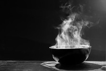 Steam Of Hot Soup With Smoke Wood Bowl On Dark Background.selective Focus