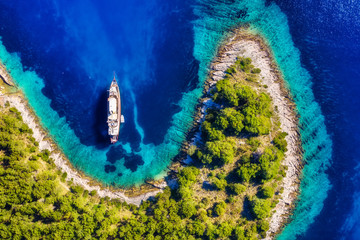 Wall Mural - croatia. yachts at the sea surface. aerial view of luxury floating boat on blue adriatic sea at sunn