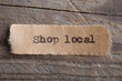 © Sensay - Shop local word on a piece of paper close up, business creative motivation concept