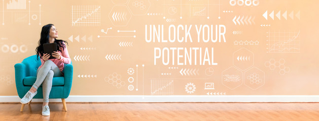 unlock your potential with young woman holding a tablet computer in a chair