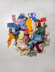 pile of used clothes on a light background. Second hand for recycling