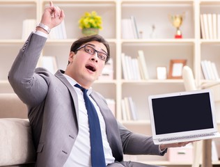 Businessman working on the floor at home