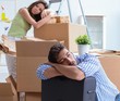 © Elnur - Young family unpacking at new house with boxes