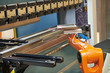 © Kadmy - Robotics in hydraulic press brake or bending machine for sheet metal.