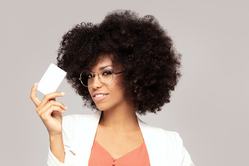 Wall Mural - Elegant young afro woman with credit card.