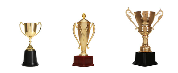 Set of different shiny gold trophy cups on white background