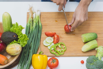 Wall Mural - Close up woman preparing ingredient for salad.