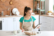 © Pixel-Shot - Beautiful woman preparing bakery in kitchen at home