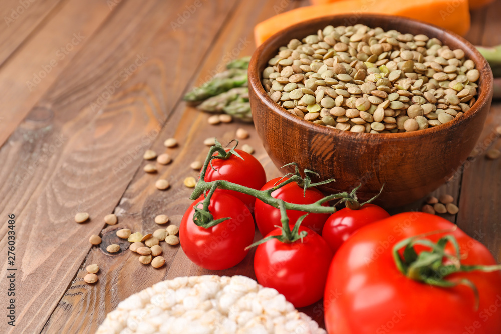 Different healthy food on wooden table