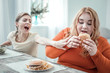 Positive delighted plump female going to eat burger