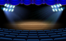 Blue Spotlight On The Stage With Blue Chairs In The Hall