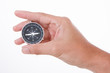 © aekkorn - Hand Holding Compass ISOLATED ON WHITE BACKGROUND.