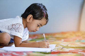 Wall Mural - indian child studying at home