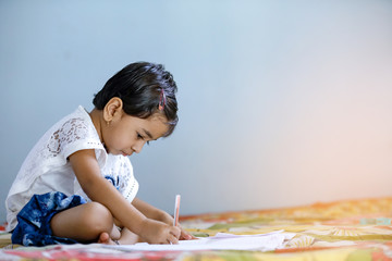 Wall Mural - indian child studying at home