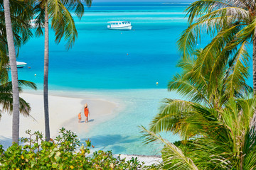 Canvas Print - Three year old toddler boy on beach with mother. Summer family vacation at Maldives.