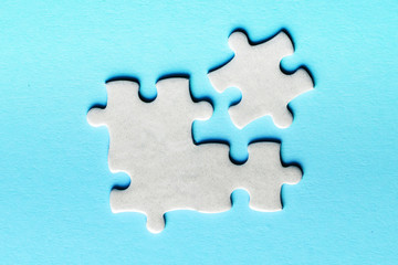Wall Mural - White details of puzzle on a blue background