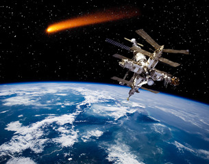 Wall Mural - Space station above the earth. Comets. The elements of this image furnished by NASA.
