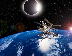 Wall Mural - Space station above the earth and solar eclipse. The elements of this image furnished by NASA.