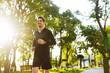 © Drobot Dean - Portrait of joyful athletic man running while doing workout in sunny green park