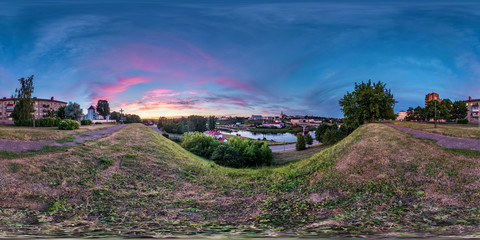 Wall Mural - full seamless spherical hdri panorama 360 degrees angle view on bank of wide river overlooking old city in sunset with beautiful clouds in equirectangular projection, ready VR virtual reality content