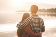 © StockPhotoPro - Loving couple hugging at the lake