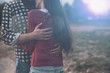 © StockPhotoPro - Young loving couple hugging outdoors
