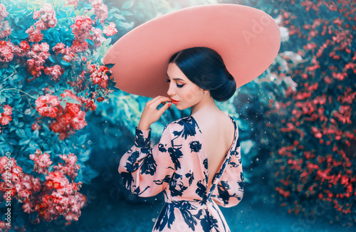 Cuadros en Lienzo cute woman with perfect gentle hairdo from long black hair wearing pink hat with