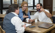© A Stock Studio - Group of business people are discussing a working draft in the office. Teamwork, brainstorming.