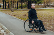 © Nana_studio - Portrait of a happy man on a wheelchair in a park