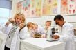 © Robert Kneschke - Children are exploring exotic animals in the laboratory
