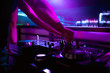 © Семен Саливанчук - DJ turntable console mixer controlling with two hand in concert nightclub stage.