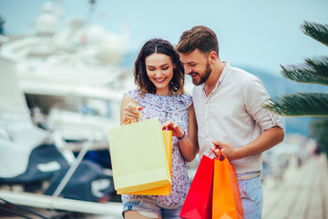 Couple on summer vacation enjoying travel and shopping