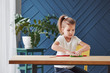 © standret - Children playing with colored plasticine on the wooden table at home