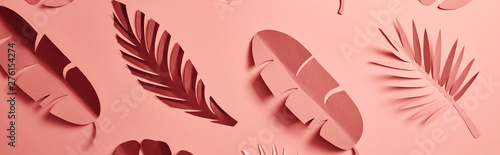 Fotografía panoramic shot of paper cut palm leaves on pink background, seamless pattern