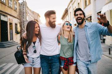 Wall Mural - Group of friends hanging out, having fun and enjoying summer days