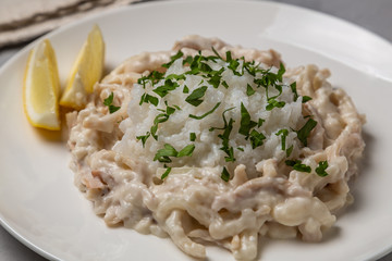 Wall Mural - Squid in sour cream sauce. Greek national dish