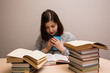 © Julia - Student girl with stack of books