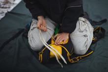 Base Jumper Packs The Parachute Before Jumping, Close-up. Parachute Jumps. Base Jumping. Parachute Equipment. Face Is Not Visible.