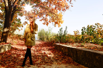 Wall Mural - Slim young woman and autumn time. 